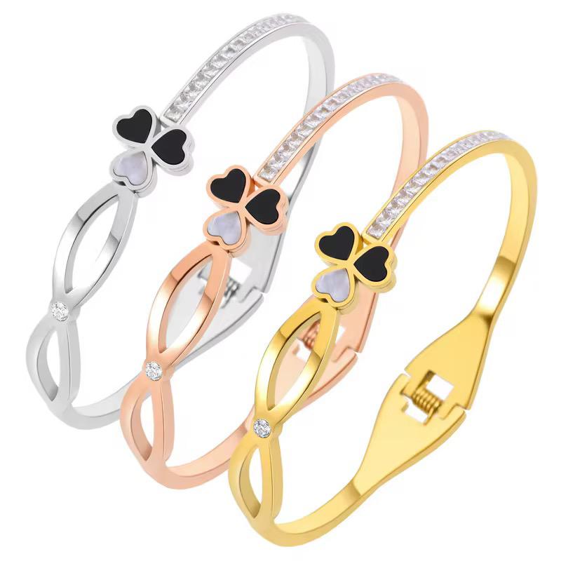 Elegant Lucky Clover Bangle, meticulously crafted in high-quality gold-plated material and adorned with sparkling zircons.