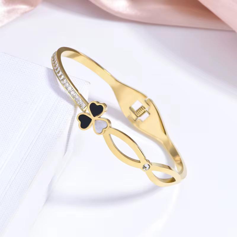 Elegant Lucky Clover Bangle, meticulously crafted in high-quality gold-plated material and adorned with sparkling zircons.