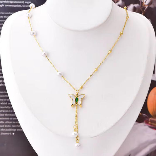 Elegant Butterfly Necklace – Gold-Plated with Pearl Accents