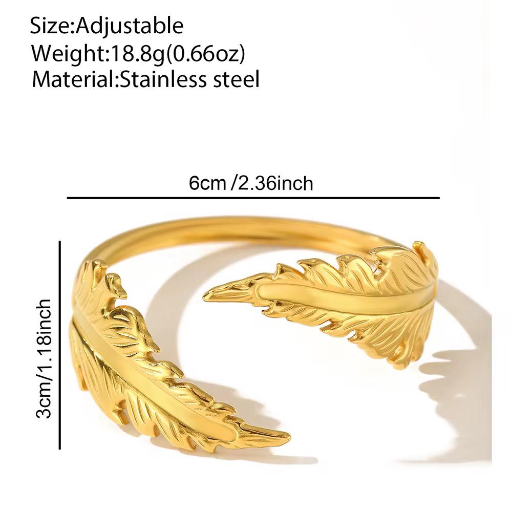 Elegant Gold-Plated Feather Cuff Bangle A nature-inspired piece that blends strength with delicate sophistication.